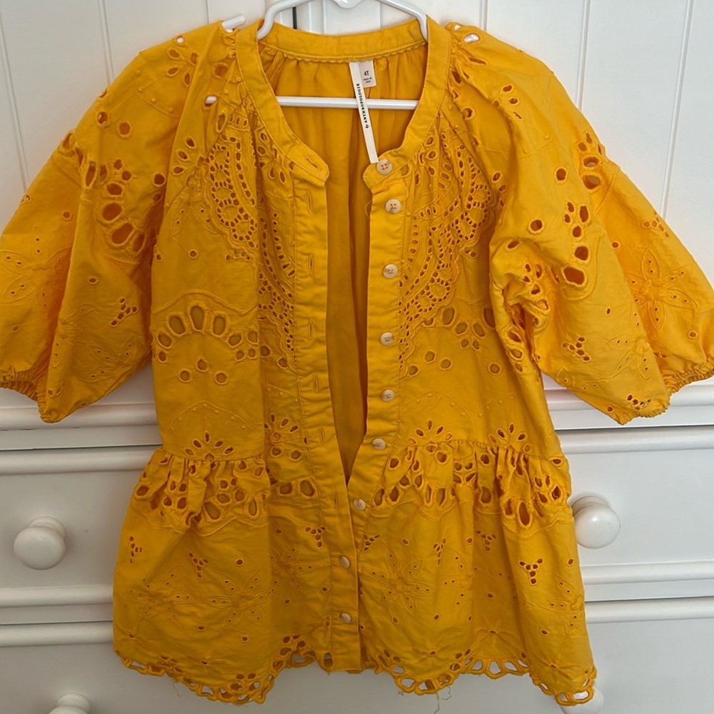 Yellow Anthropologie drop waist dress with eyelit detail and puff sleeves